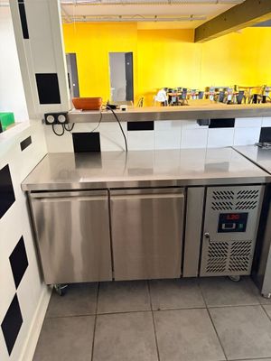 a kitchen with a stainless steel refrigerator and a dishwasher in it