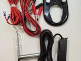 a remote control and wires on a table