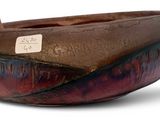 a brown bowl that has a label on it