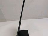 a tablet that is sitting on a stand on a table
