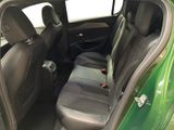 the back seats of a green car are clean and ready to be used