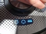 a close up of a person ' s hand pressing a button