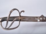 a close up of a sword with a metal handle