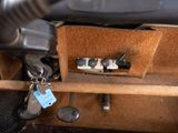 a close up of a car dashboard with a bunch of keys in it