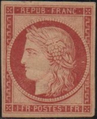 a red and black stamp with a woman ' s head on it