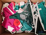 a box full of underwear and a pair of shoes