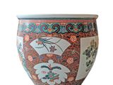 a large vase with oriental designs on it on a white background