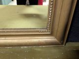 a reflection of a person in a mirror in a room