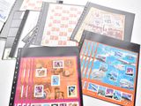 a lot of different types of stamps on a table