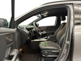 the interior of a car with the door open and the driver ' s seat down