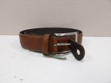 a close up of a brown belt with a black buckle