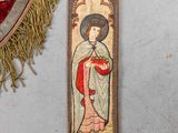 a red and gold banner with a picture of a woman on it