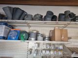 a shelf full of pots and pans on the wall