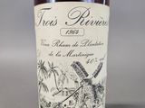an image of a bottle of liquor with a windmill in the background