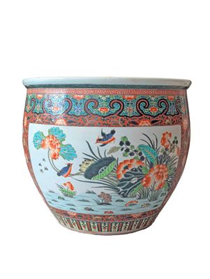 a large vase with a bird and flowers on it