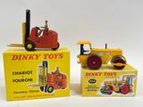 two toy vehicles sitting next to each other on a table