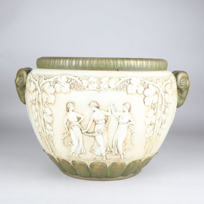 a white vase with a design on it