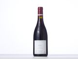 a bottle of wine that is sitting on a table
