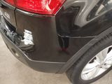 a close up of the rear end of a black car