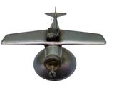 a small metal airplane with a propeller on a white background
