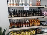 many bottles of beer on the shelves in the store