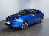 the blue car is parked in a white room with a black floor