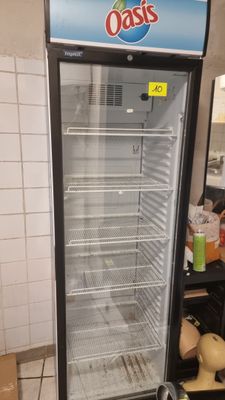 an image of a refrigerator in a kitchen with a sign on it