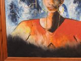 painting of a woman in a red shirt and earrings in a wooden frame
