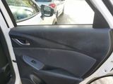 a white car with the door open on the side of the road
