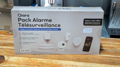 a box that is sitting on a table with a phone in it