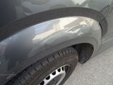 a close up of a car ' s front bumper and fender