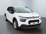 the white citrole is parked in a large room