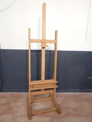 a wooden easer that is standing in a room