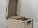 an open suitcase with a handle on it on a white surface