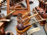 many different types of pipe holders on the table