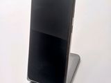a cell phone that is sitting on top of a stand