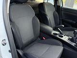 the interior of a car with two black seats and a steering wheel