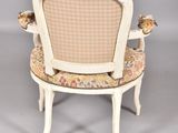 an image of a chair with a bird on the back of it