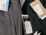 two pairs of pants with a price tag on them