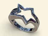 a close up of a silver ring with a star on it