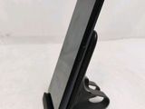 a close up of a cell phone on a stand