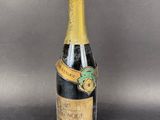 a bottle of champagne with a label on it sitting on a table