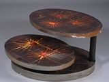 two tables that are sitting side by side on a table