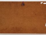an image of a piece of brown paper on a white surface