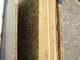 a close up of a book with a bookmark sticking out of it