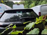 a car that is parked in a lot with other cars