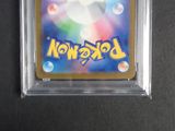a close up of a pokemon trading card in a plastic case