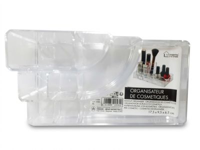 a close up of a clear container with makeup brushes in it