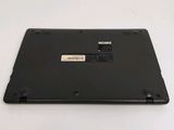 the back of a laptop with a small battery on top of it