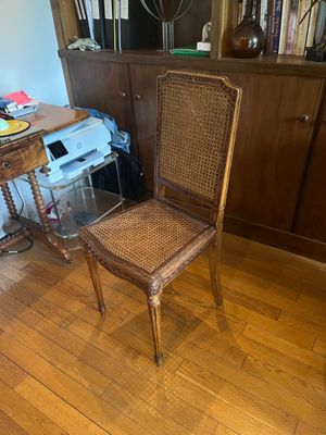 a chair that is sitting in the middle of a wooden floor